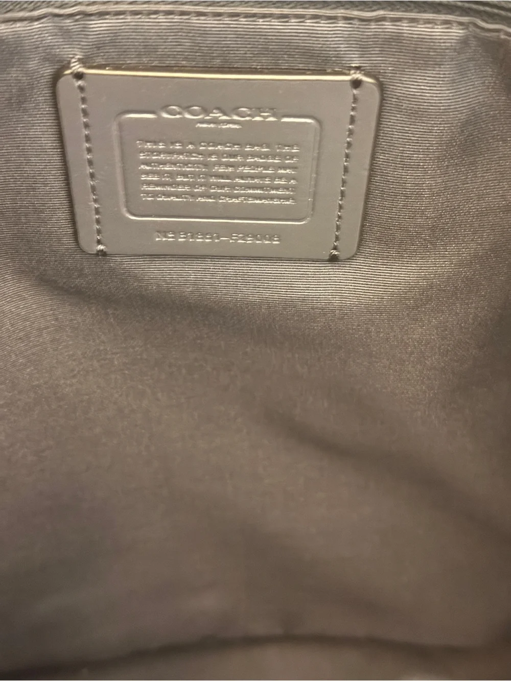 COACH Black Pebbled Leather Drawstring Backpack with Front Pockets